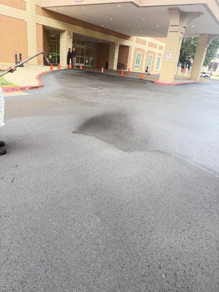 ADA access aisle striping and handicap parking lot markings at Embassy Suites Charleston WV completed by Elite Pavement Maintenance.