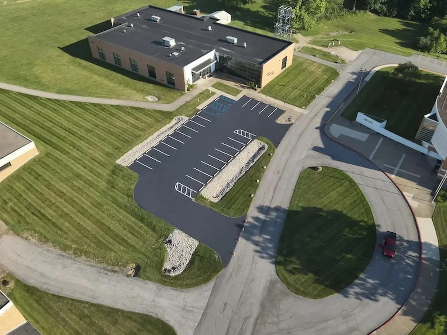 Commercial asphalt sealcoating services in Parkersburg WV by Elite Pavement Maintenance for protecting parking lots and commercial pavement.