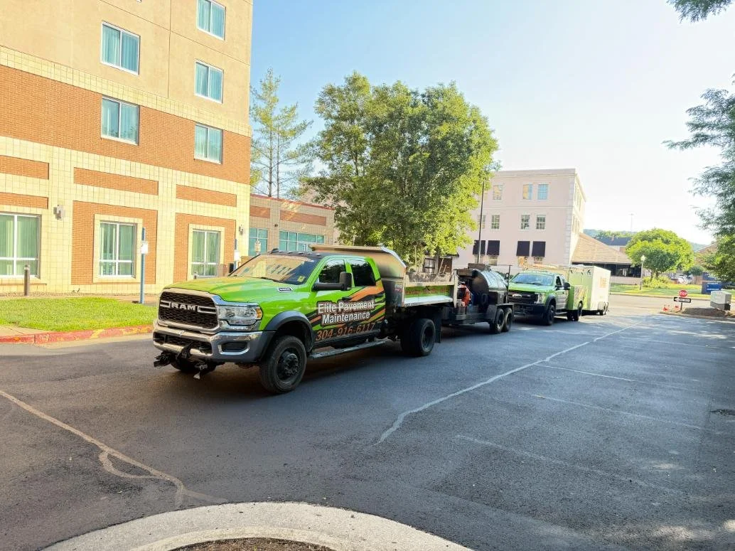 Close-up of asphalt pavement surface after commercial parking lot sealcoating at Embassy Suites Charleston WV.
