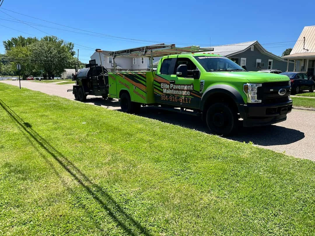 Residential driveway sealcoating in Ripley WV with fresh black asphalt finish helping protect against weather and surface cracking.