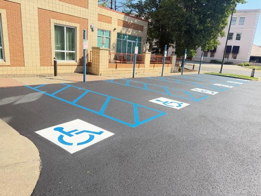 Fresh parking lot line striping at Embassy Suites Charleston WV following a two-coat commercial sealcoating application.