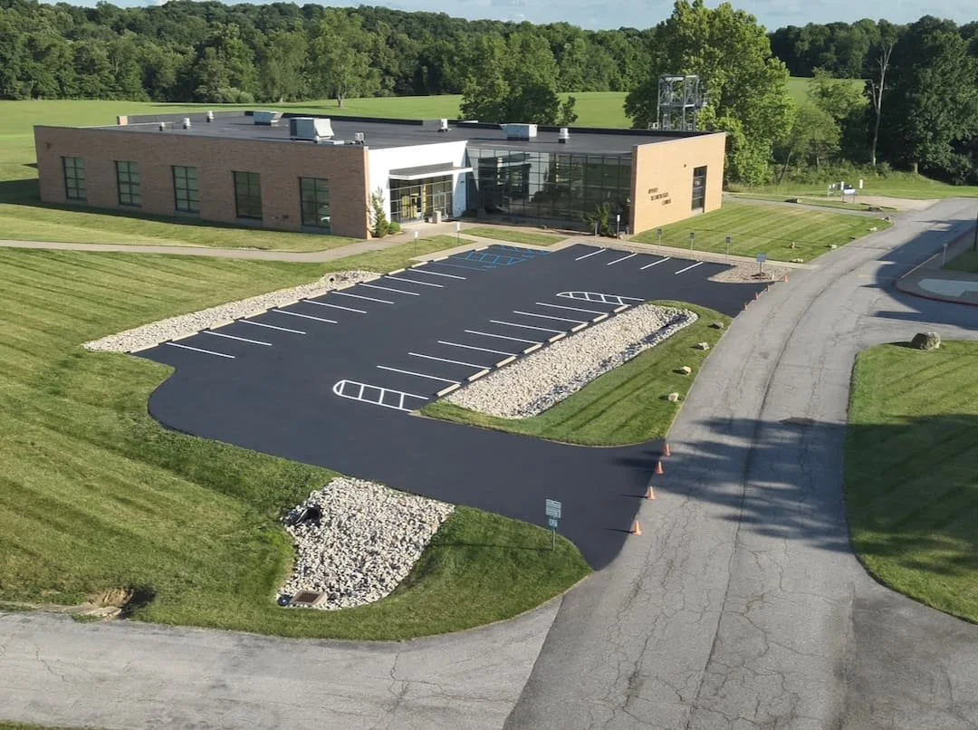 Fresh asphalt sealcoating protecting a commercial parking lot in Moundsville WV