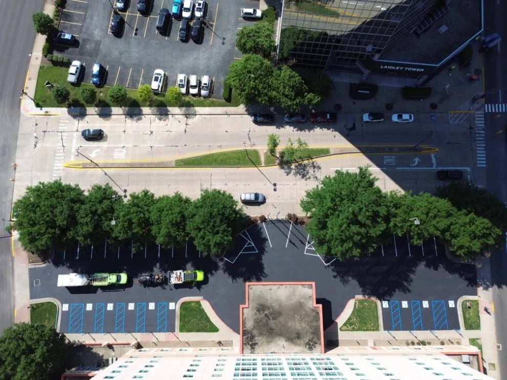 Professional parking lot striping equipment used during the Embassy Suites Charleston WV pavement maintenance project.