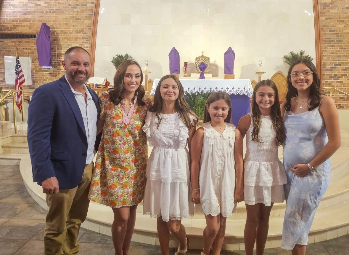 Mandi St.Germaine family at a church