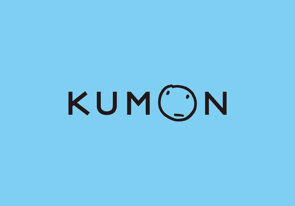 Kumon logo with a stylized sad face emoji replacing the letter 'O' on a light blue background.