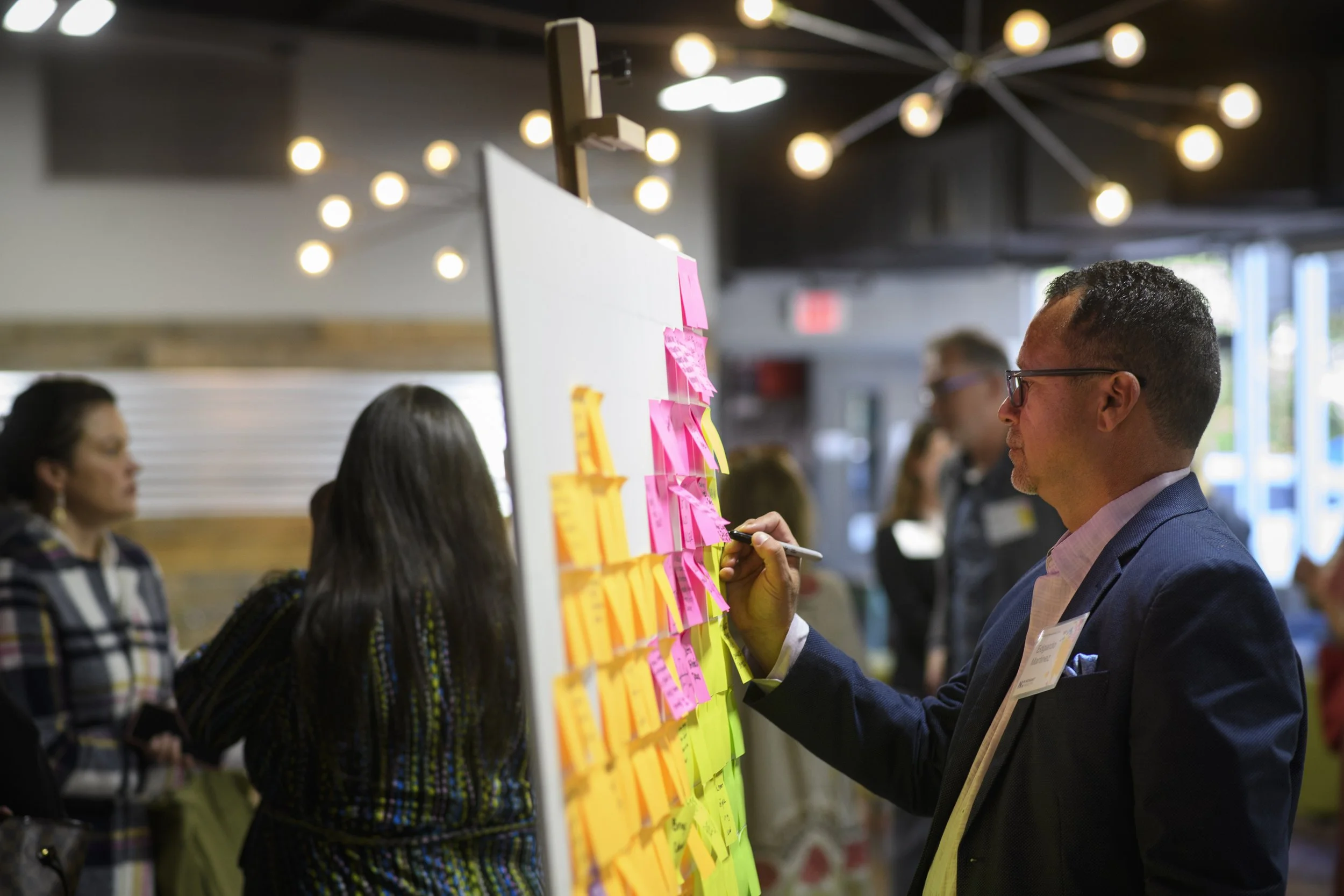 Novant Health Event. Ms. Meikle created the pixel art interactive post-it note board. 