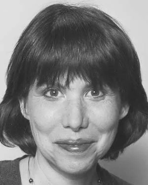 Black and white close-up of a woman with short, dark hair and a slight smile.