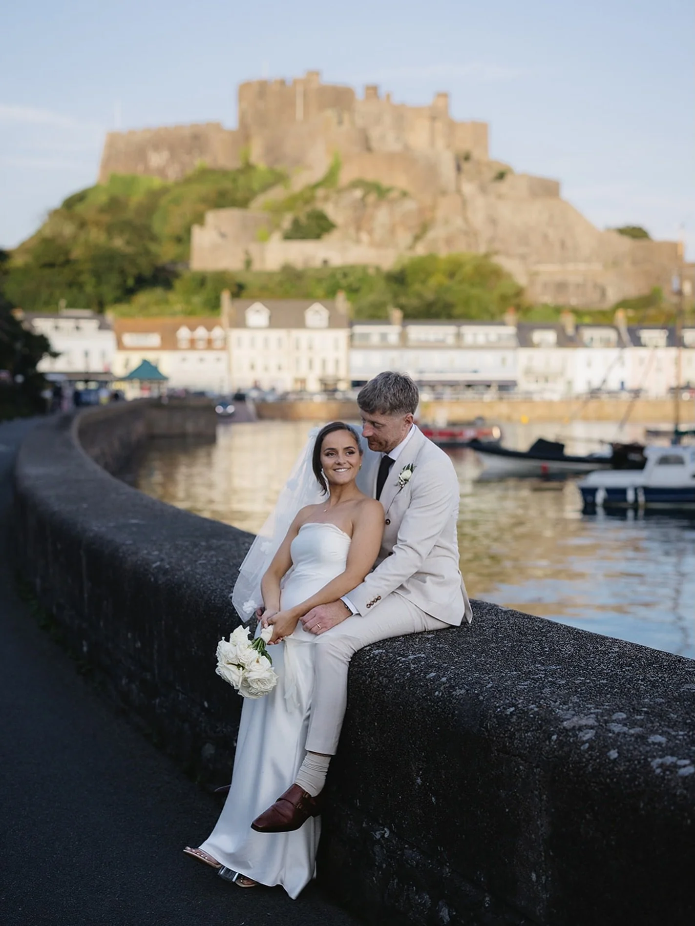 Soft evening light, castle views, and a few quiet minutes together after the celebrations.
Jersey really does give us the most beautiful backdrops.

#JerseyWeddingPhotographer #JerseyWedding #GoreyWedding #MontOrgueilCastle #ChannelIslandsWedding