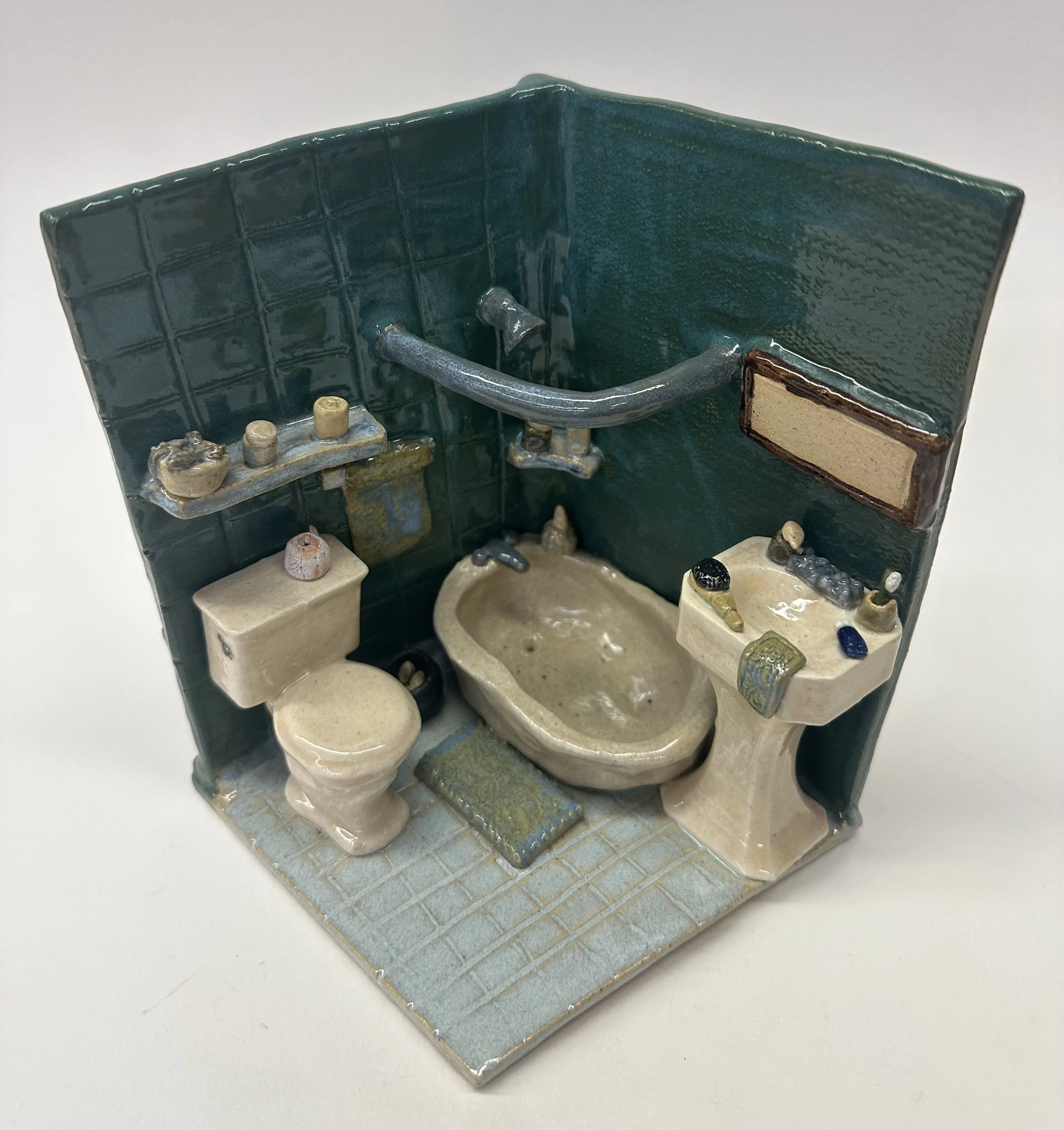 Ceramic bathroom consisting of hand built furniture pieces and decorations