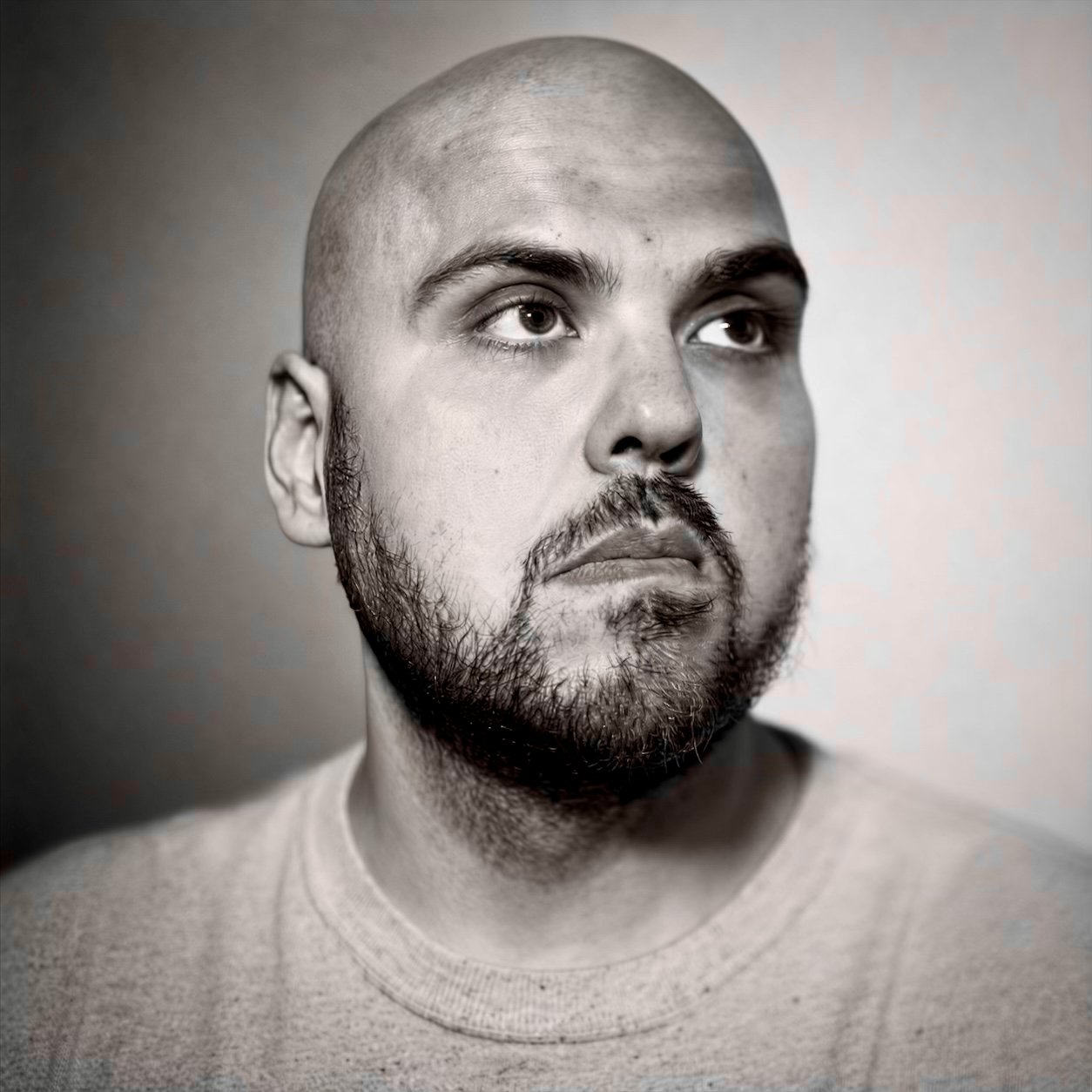 Black-and-white self-portrait of photographer Jackie Wyzykowski.
