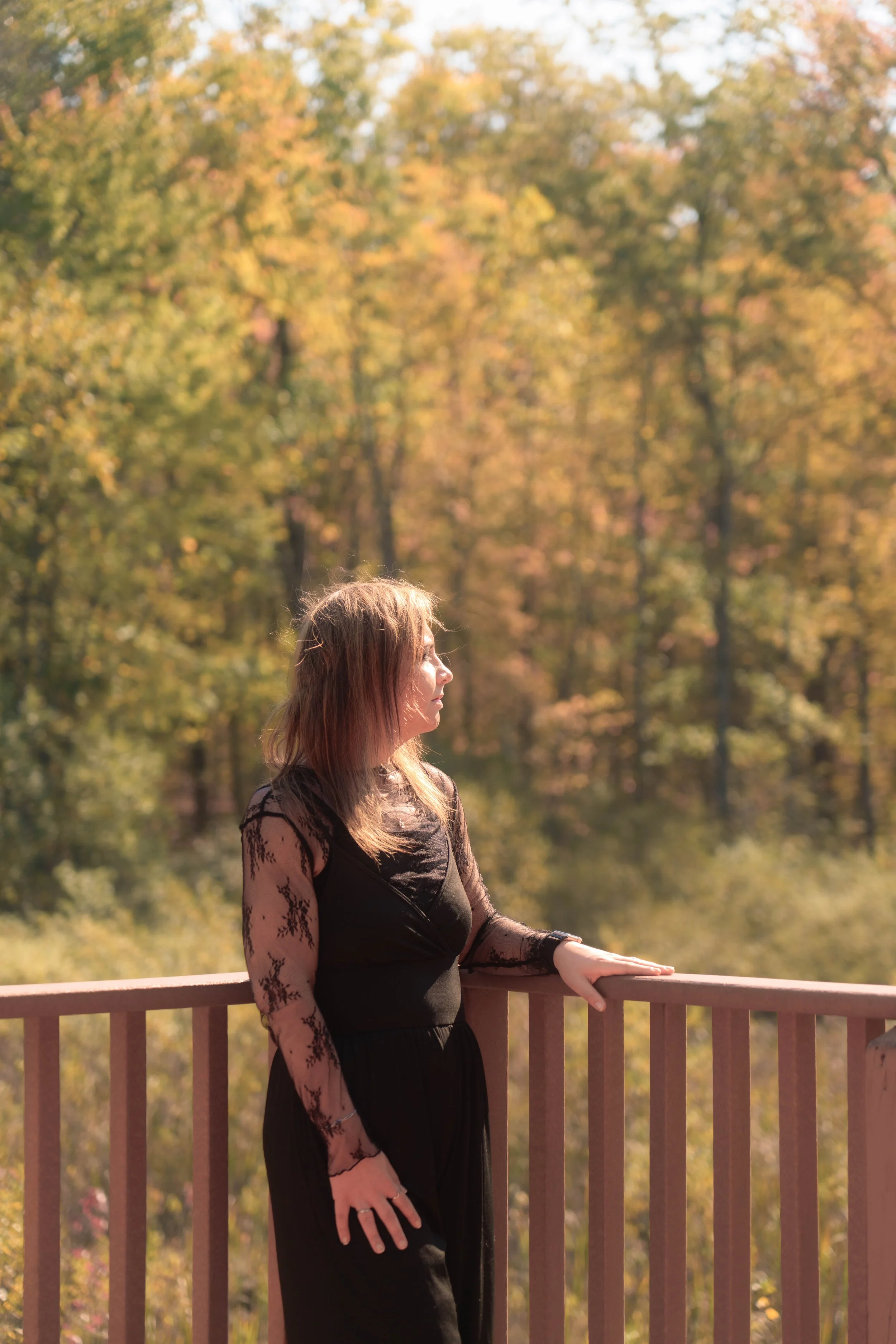 A contemplative moment captured outdoors, focusing on expression and natural light rather than posed direction.