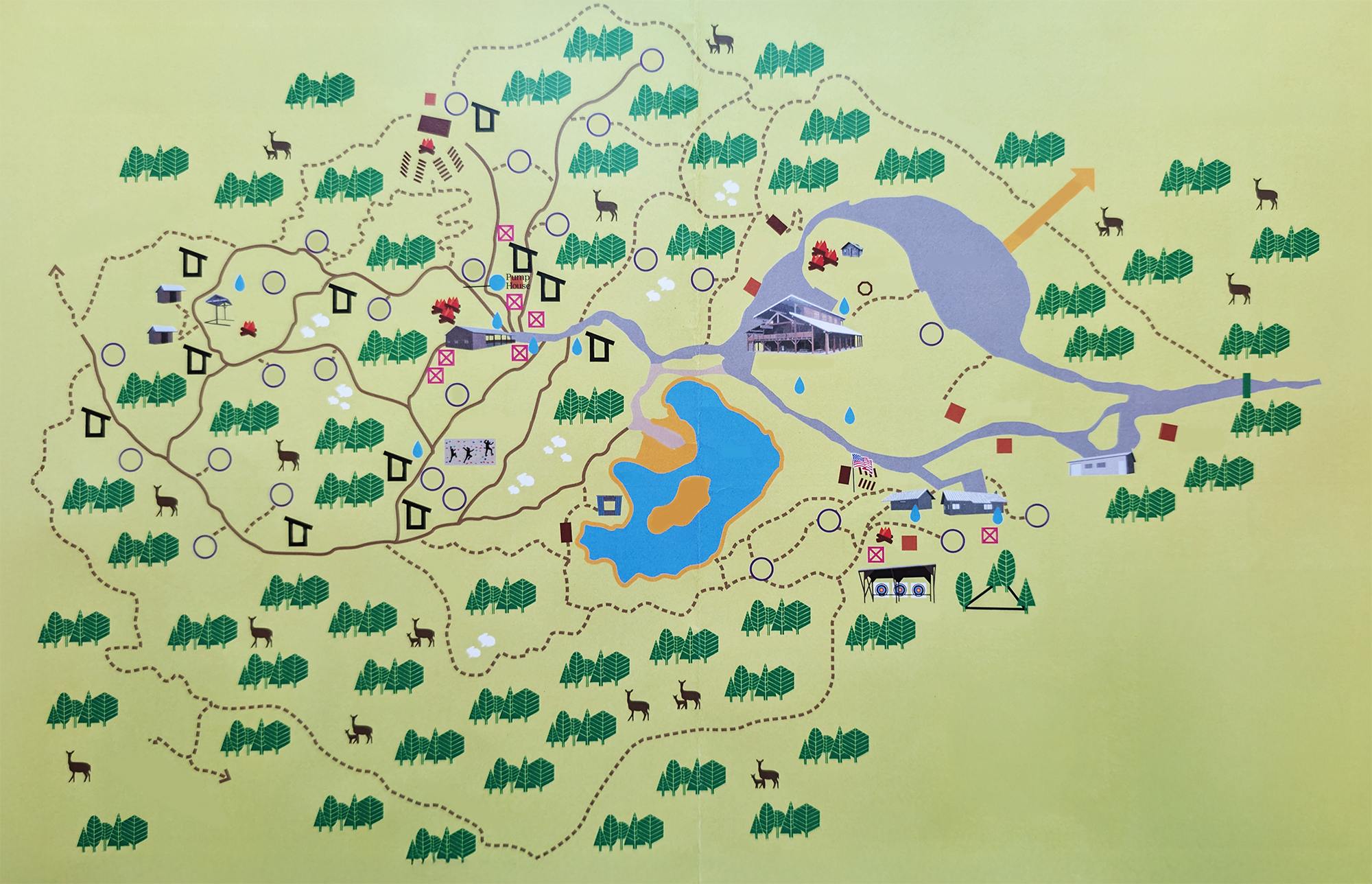 A detailed map of a park or nature reserve showing trails, water bodies, and various facilities like lodges, picnic areas, and activity zones. The map features icons of trees, lakes, animals, and structures, with directions marked by arrows.