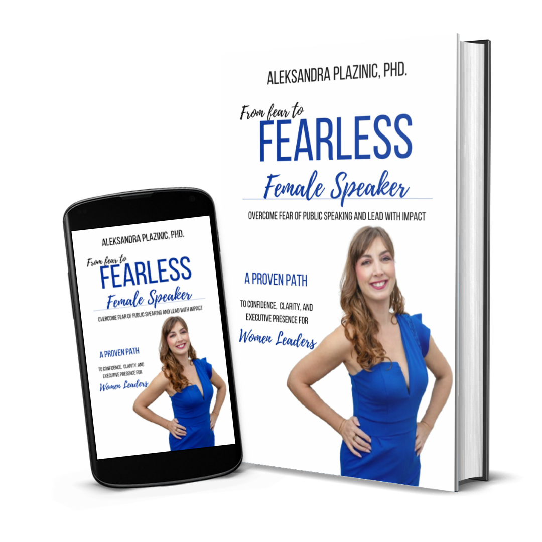 Book and phone displaying a cover titled "From fear to FEARLESS Female Speaker" by Aleksandra Plazinic, PhD, featuring a woman in a blue dress smiling with her hand on her hip.
