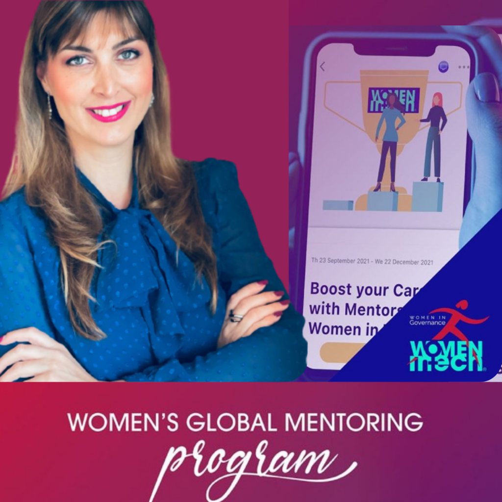 A woman with long, light brown hair, wearing a blue blouse with polka dots and a bow tie, smiling and crossing her arms, standing next to a smartphone displaying a program titled "Boost your Career with Mentors Women in Tech." A logo in the bottom ri