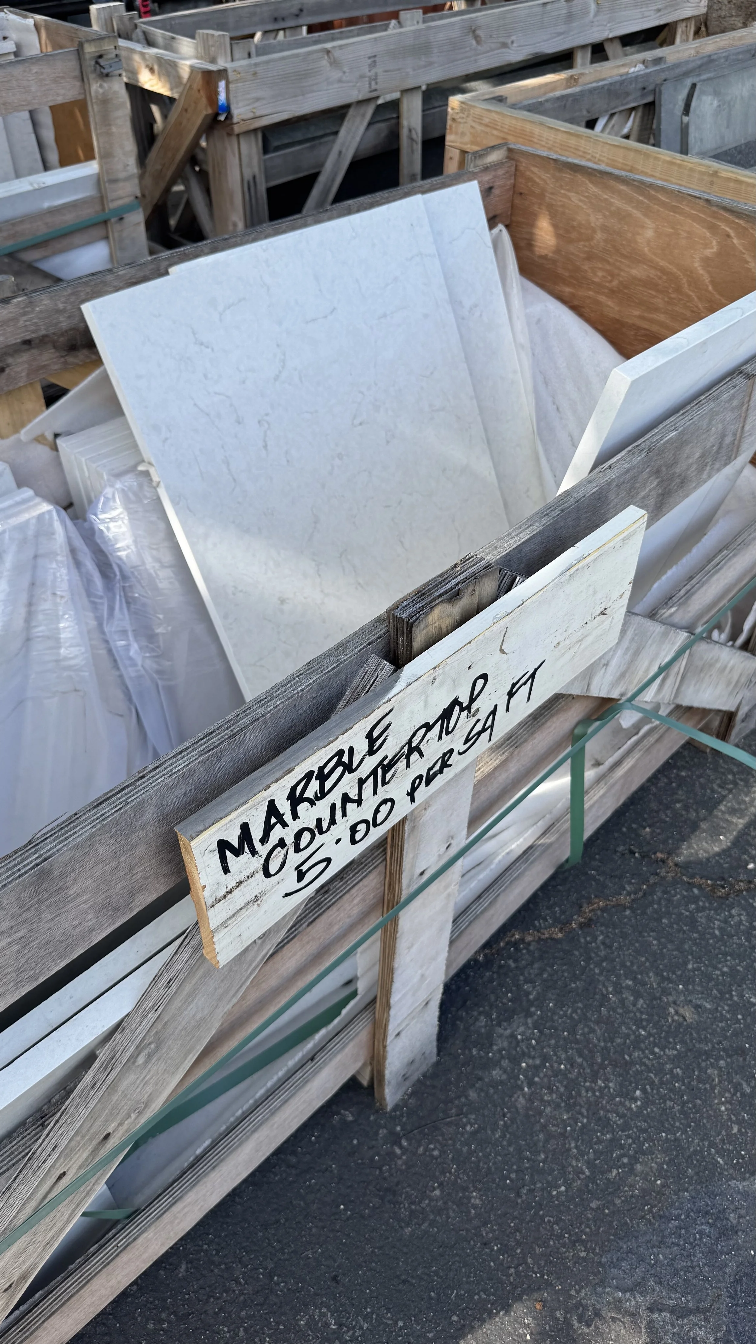 A close-up image of examples of marble countertops for sale at Re-use Hawai‘i.
