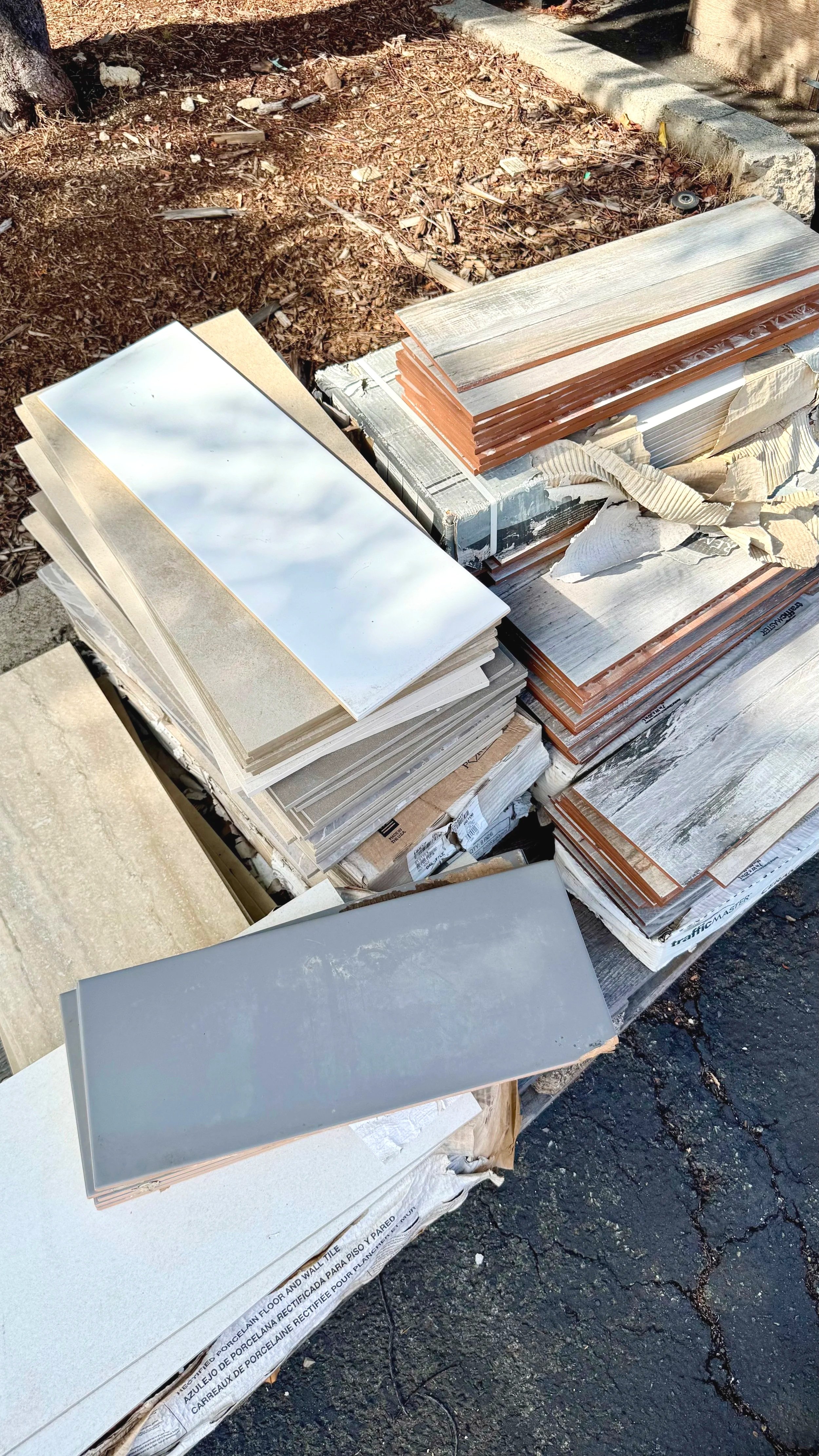 A close-up image of flooring and tile available in the Lumberyard at Re-use Hawai‘i.