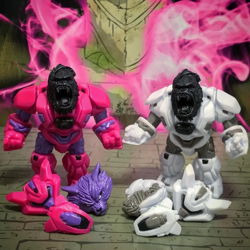Two toy gorilla figures with fierce expressions and muscular bodies, one pink and purple, the other white and gray, stand on a wooden surface. In front of them, disassembled toy parts and a purple wolf-like head are arranged. A colorful drawing with 