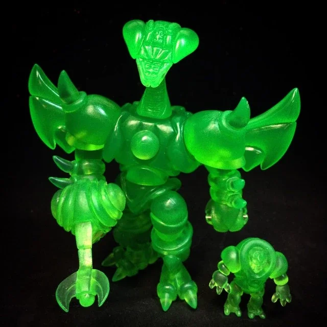Glow-in-the-dark green toy monster with a wings and a smaller matching figure.