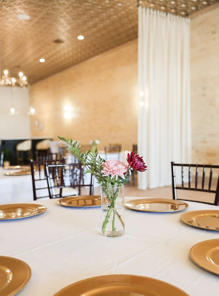 The Venue by Chateau Claire interior view with tables, linens, and chairs, in Hondo, Texas.