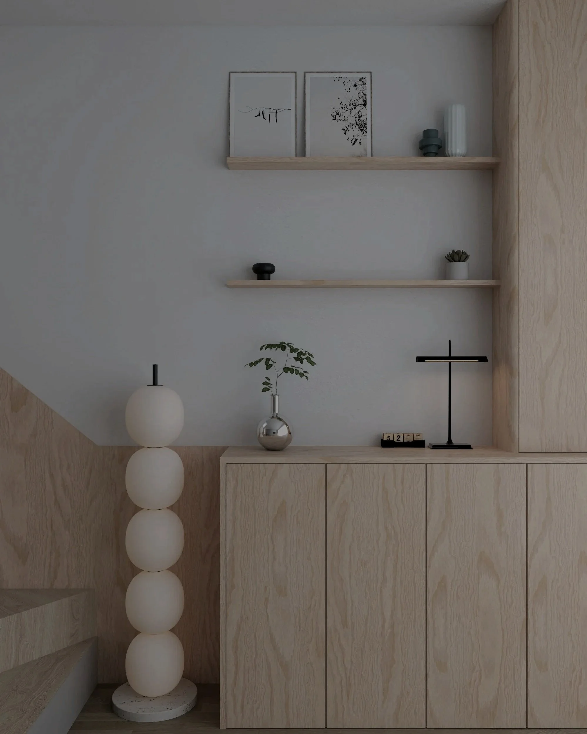 Minimalistisches Wohnbild mit hellem Holzschrank, Dekorationsgegenständen, Wandbildern und einem Stehlampe aus weißen Kugeln.