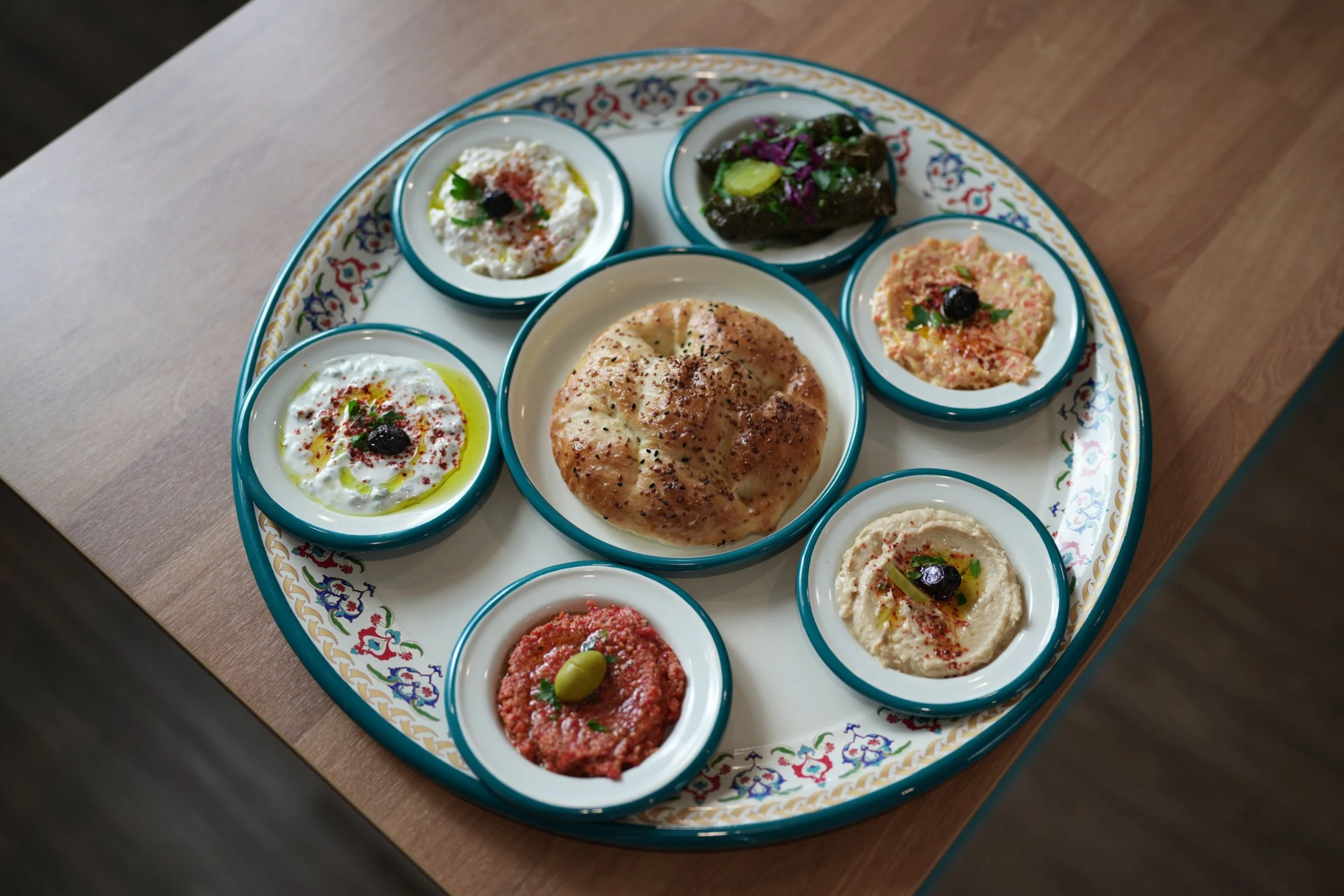 Turkish mezze platter with dips and fresh bread at Bernas Restaurant and Bakery in Issaquah Washington
