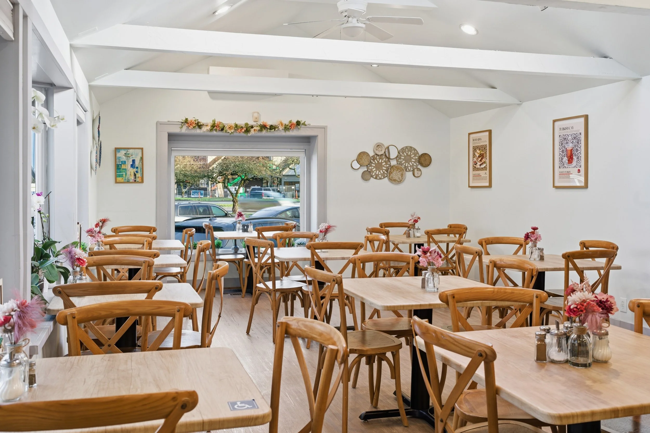Interior of Bernas Bakery Cafe and Turkish Restaurant in Issaquah with wooden tables and cozy atmosphere