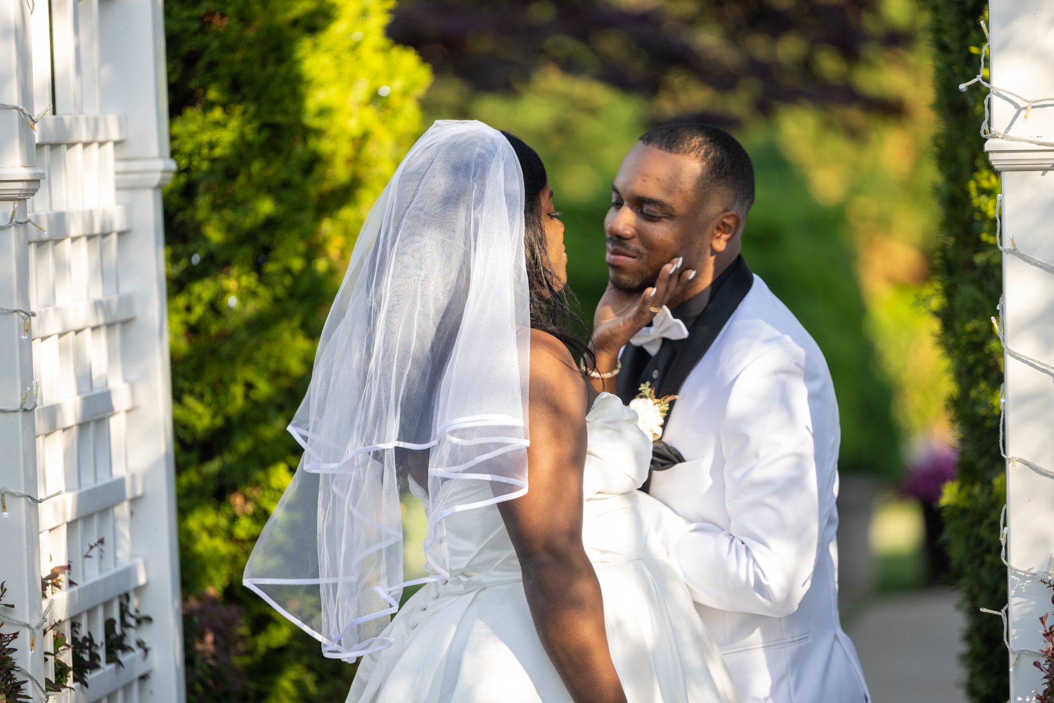 Bride and groom sharing a romantic moment during their wedding at The Warrington in Warrington, PA