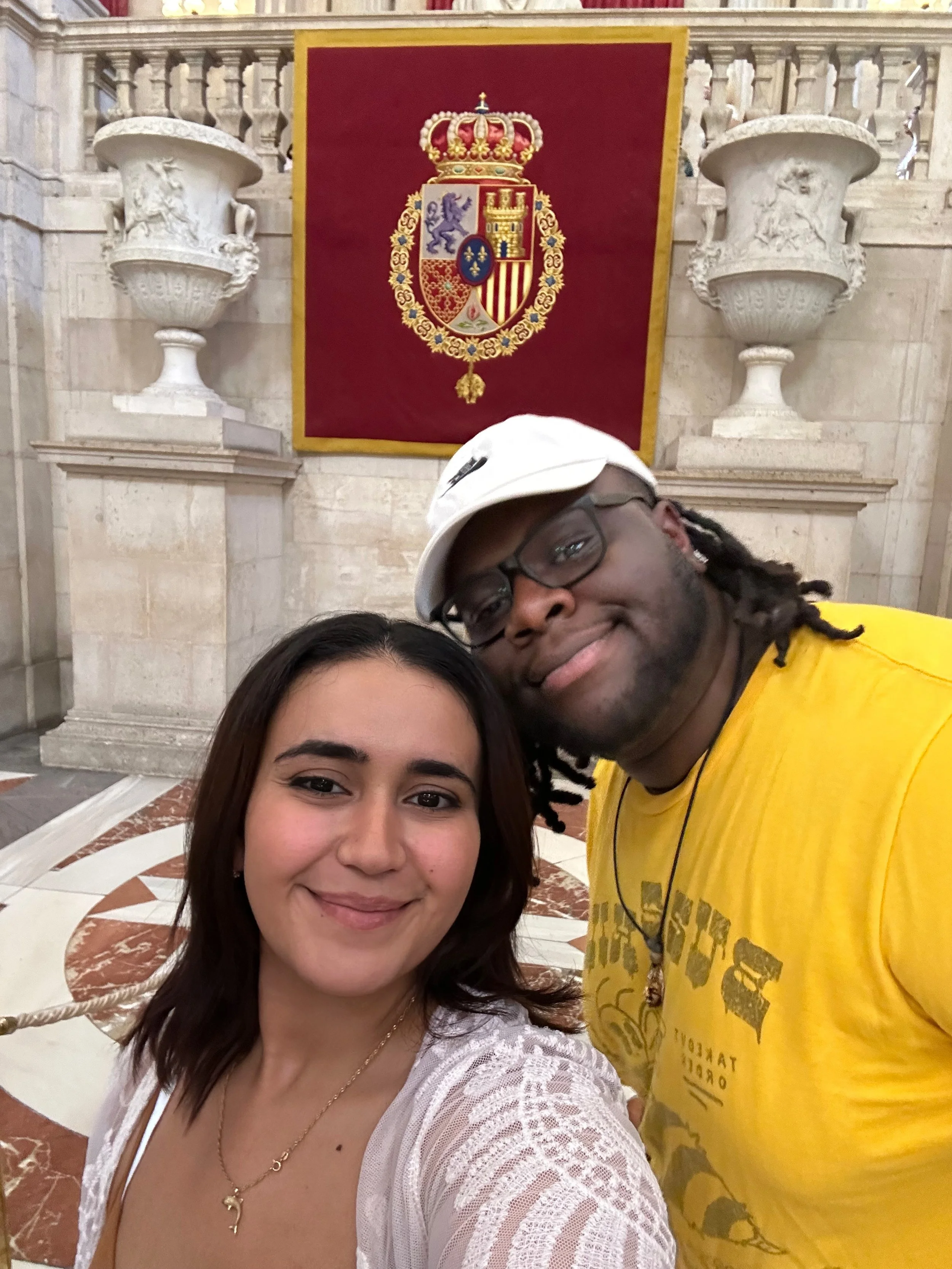 Photographer David Pierre and his fiancee taking a selfie at the Royal Palace in Madrid, Spain