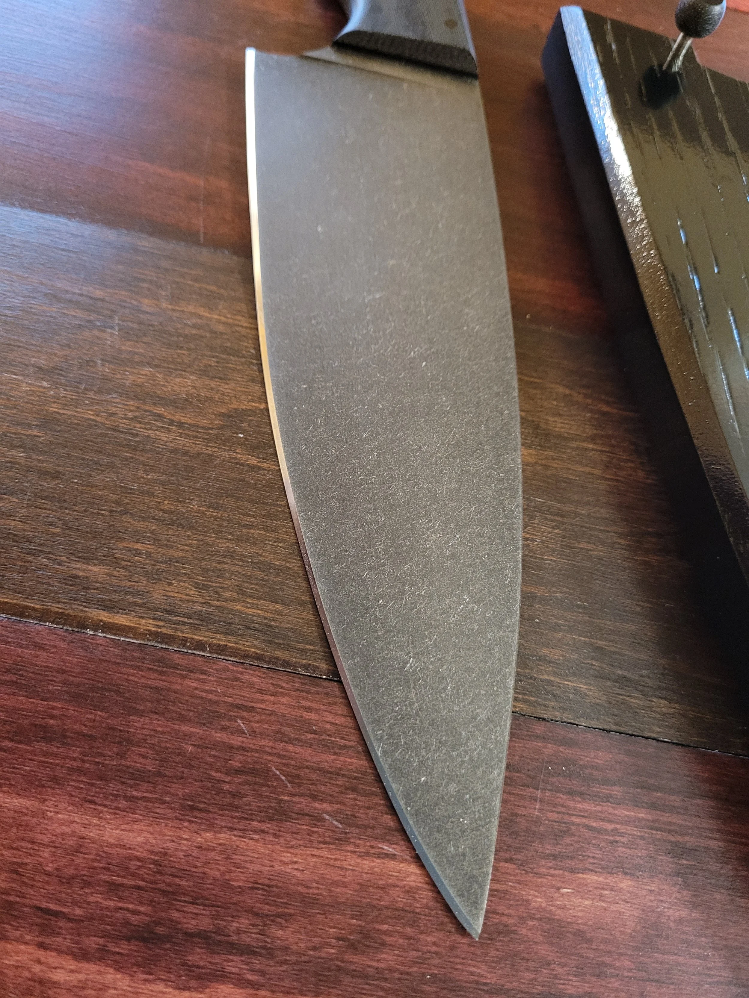 Carbon steel blade has been etched and stone washed.