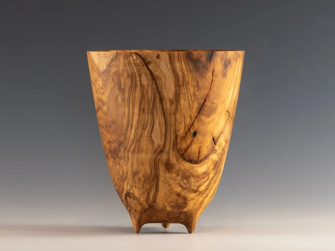 Olive vase with carved feet