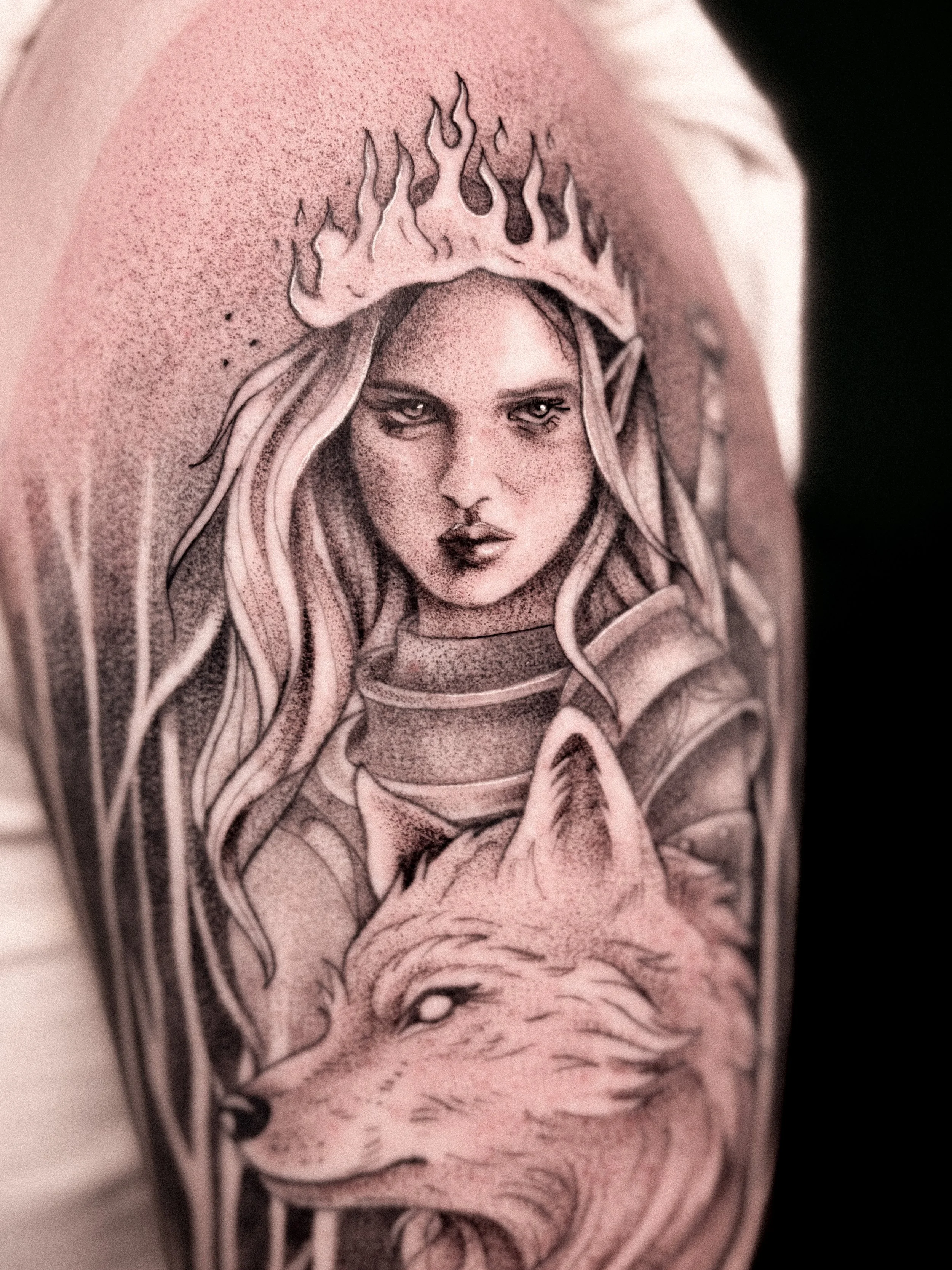 Throne of Glass tattoo of Aelin with flowing hair and a crown of flames.