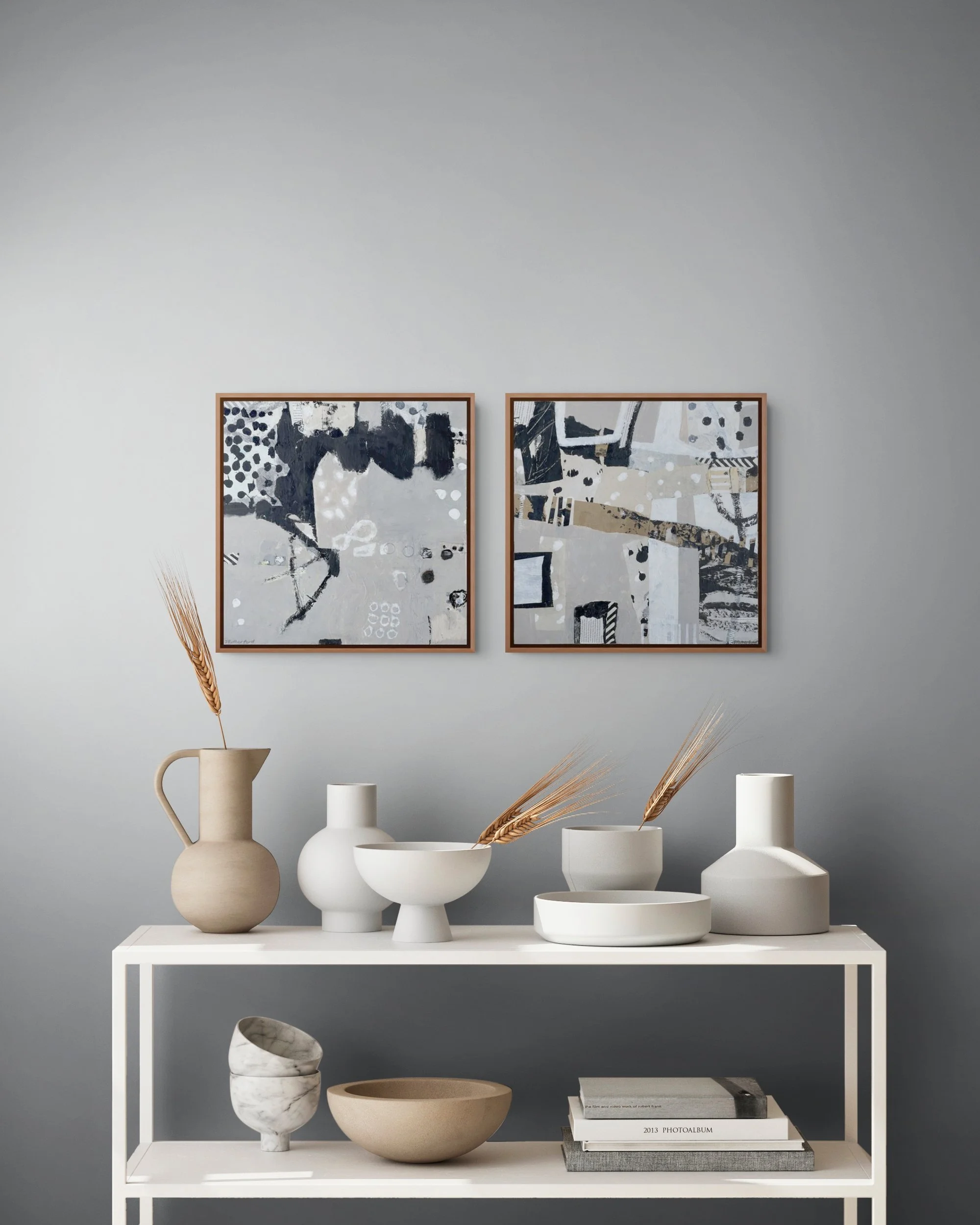 A Journey to Somewhere and Urban Deviations displayed as a pair over Funky utensils on shelves