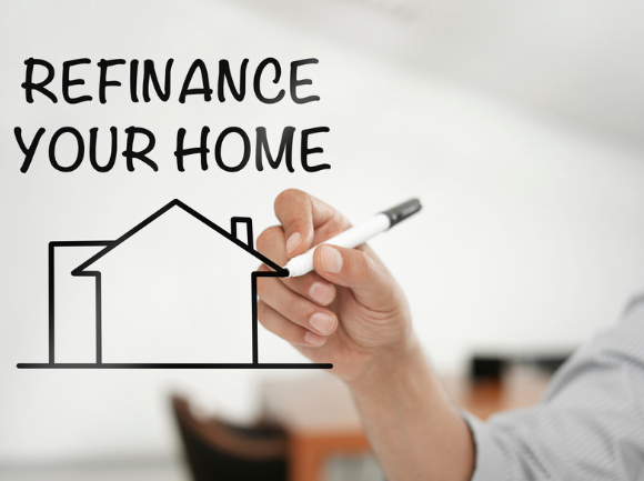 A person is drawing a house with a marker on a transparent surface, with the words "REFINANCE YOUR HOME" written above.
