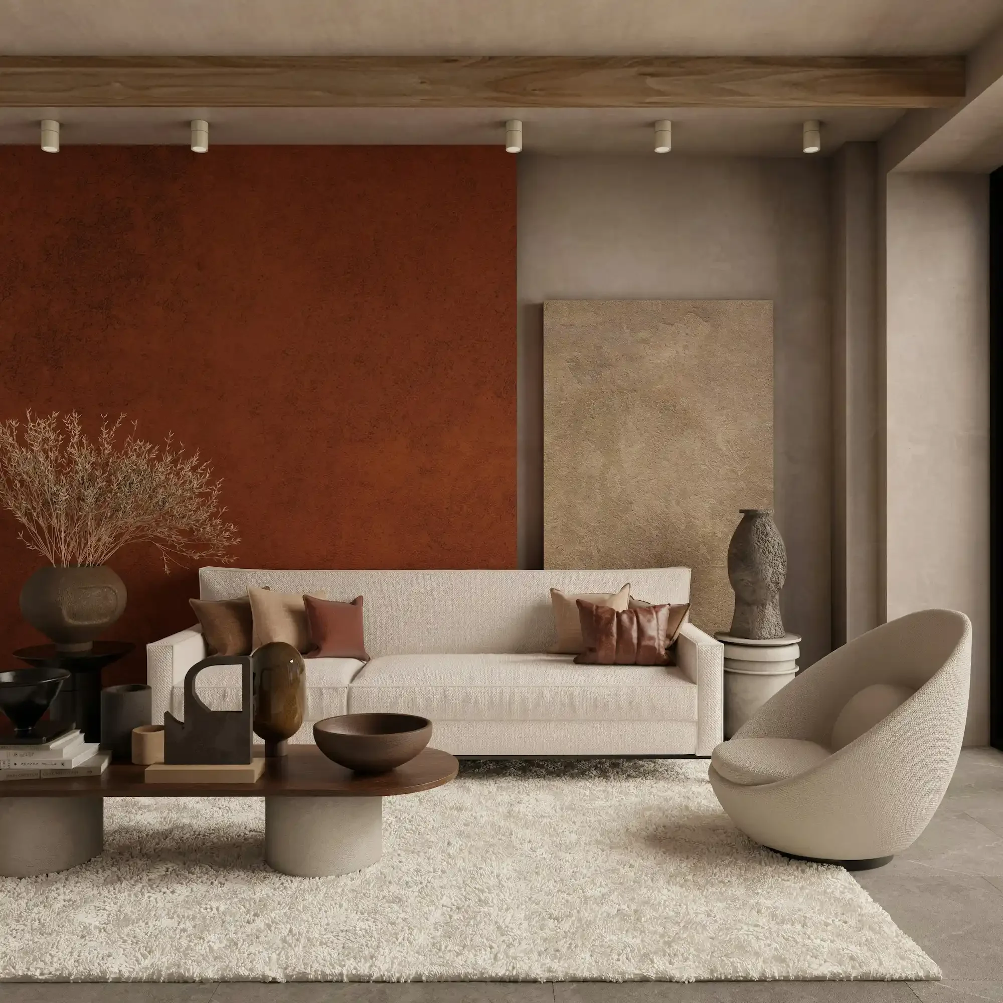 Modern organic living room featuring a deep terracotta Venetian plaster feature wall, contrasted by a large beige textured art panel, exposed wooden beams, and a curved white bouclé sofa.