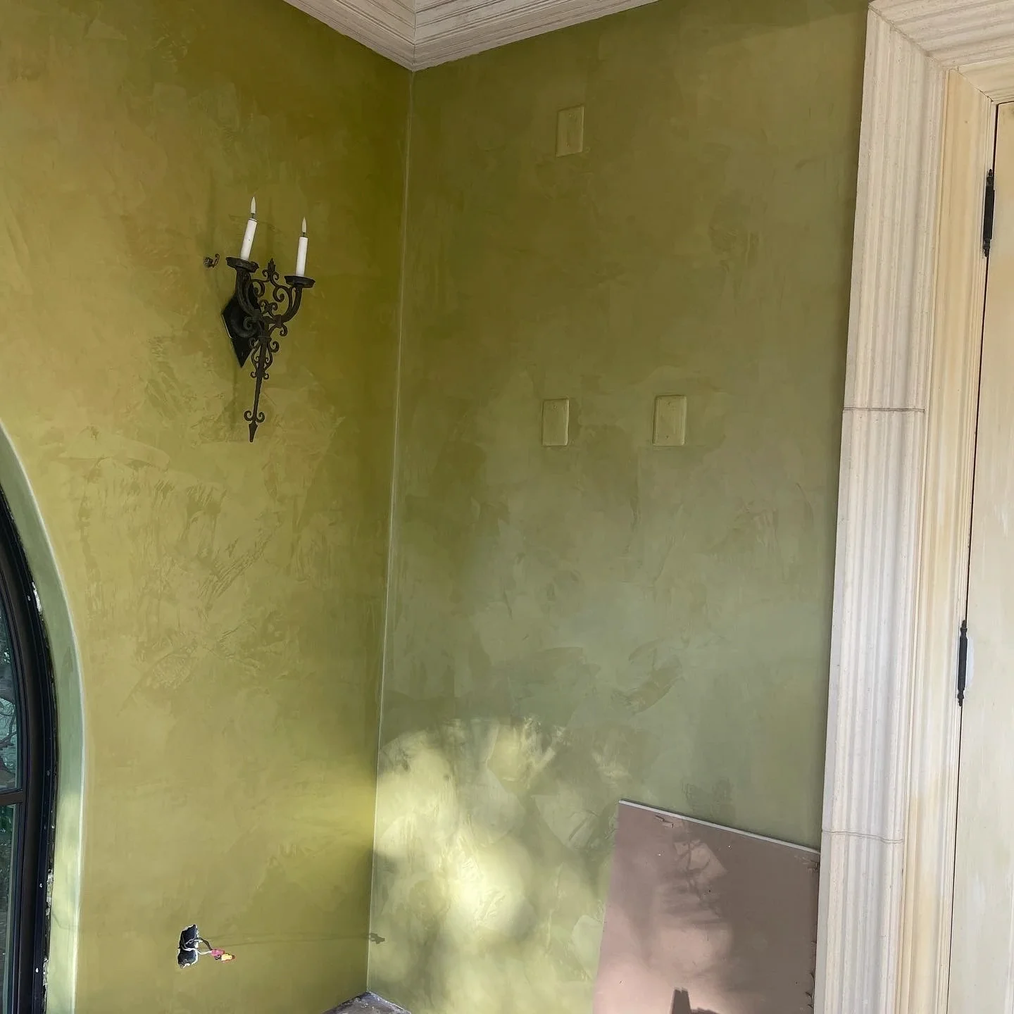 olive-green-suede-plaster-textured-accent-wall.webp