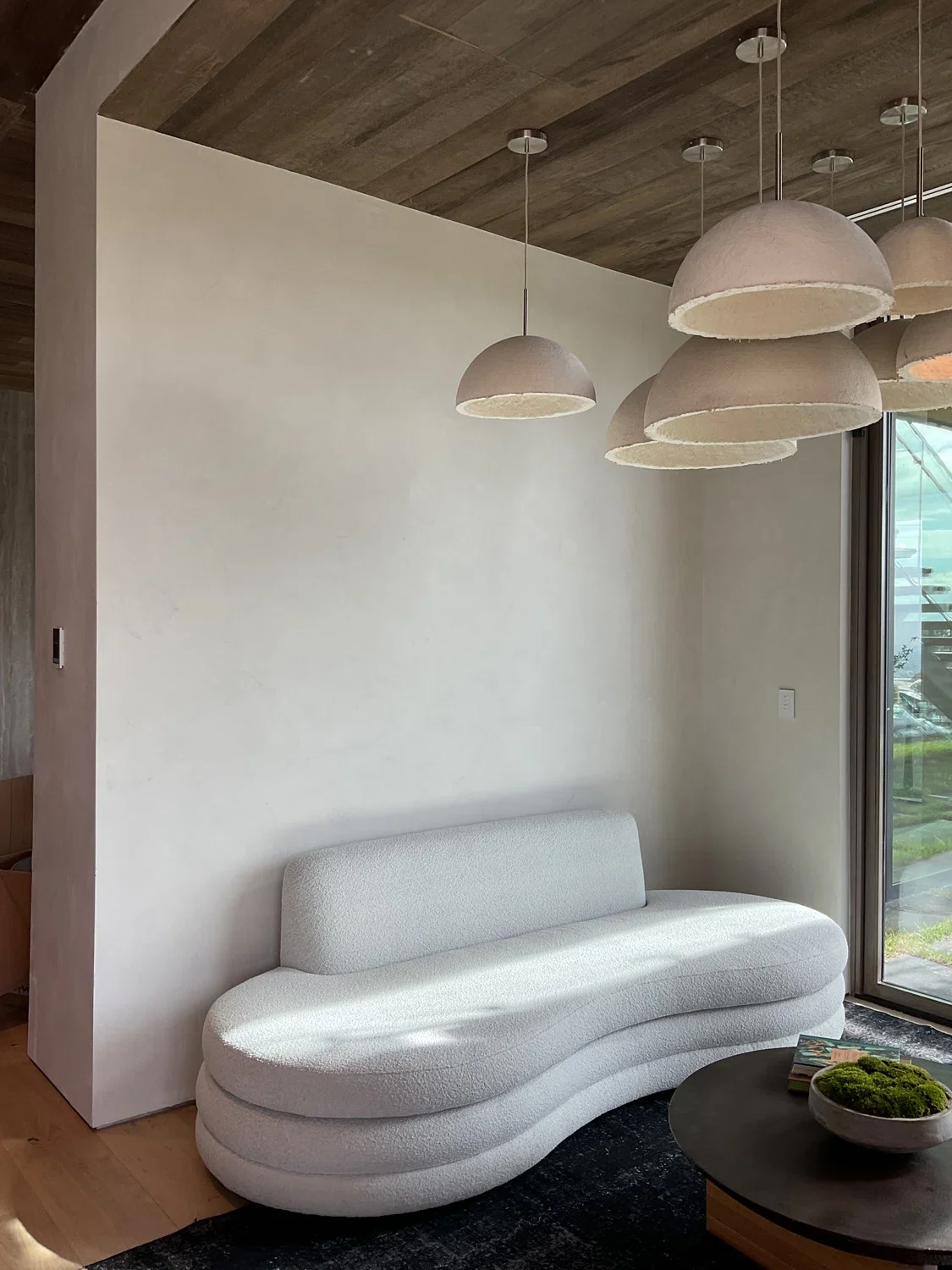 Custom off-white Venetian plaster accent wall in a luxury living area designed for Richard Heyman’s Beverly Hills home.