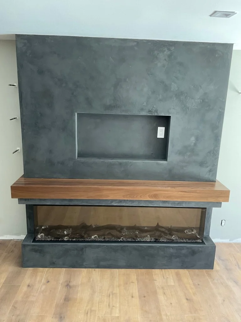 charcoal-matte-venetian-plaster-modern-fireplace.webp