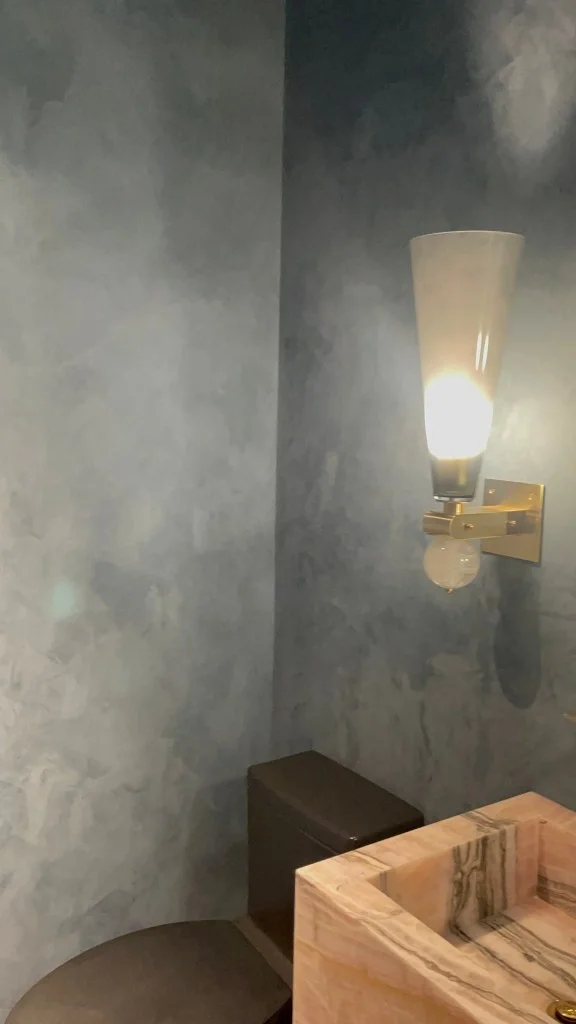 blue-grey-mottled-clay-plaster-powder-room.webp