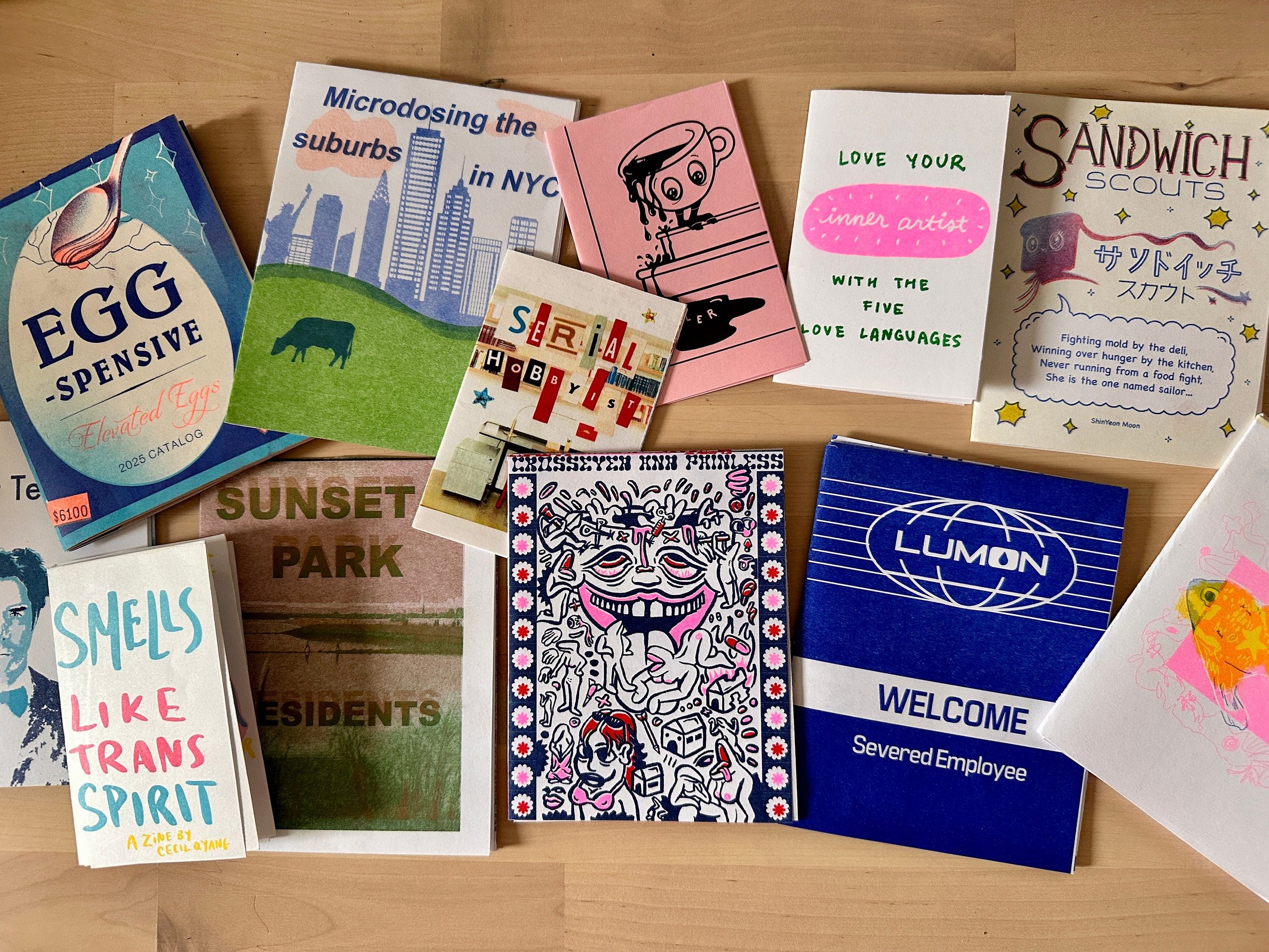 Collection of one page zines by various artists, taken by Carolyn Yoo