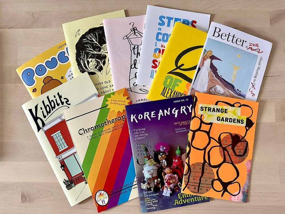 Collection of booklet zines, taken by Carolyn Yoo