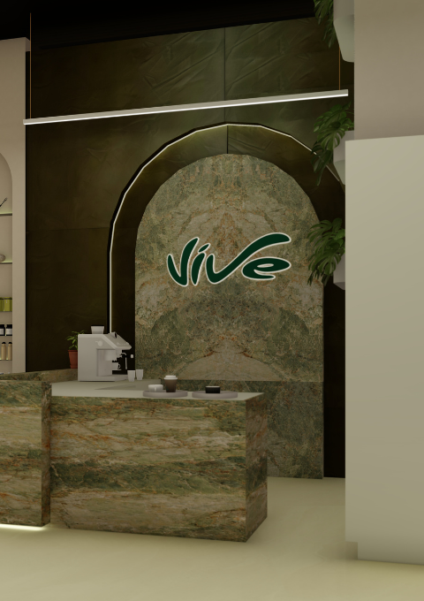 Interior of a modern workspace with a green marble reception desk and a large green marble wall featuring a Nive logo.