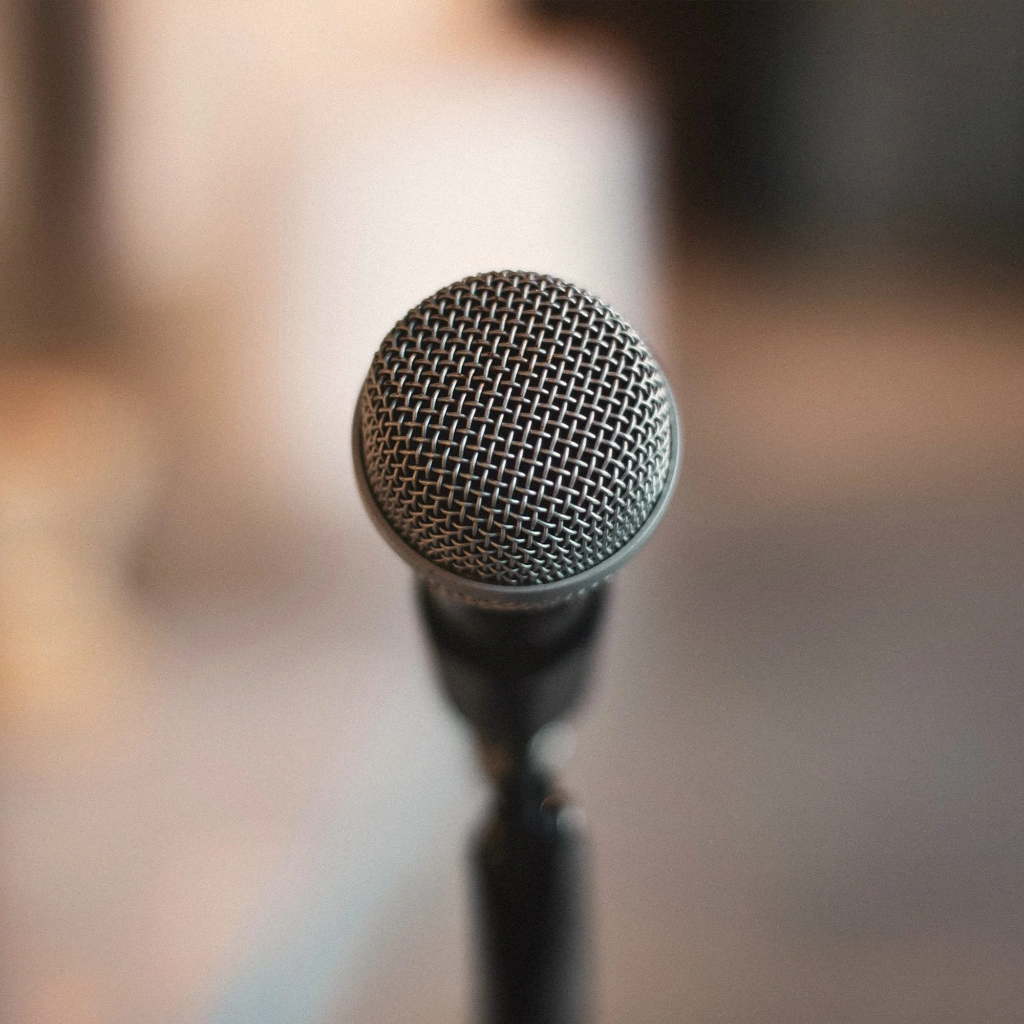 Professional microphone close-up representing keynote speaking, facilitation and communication skills training