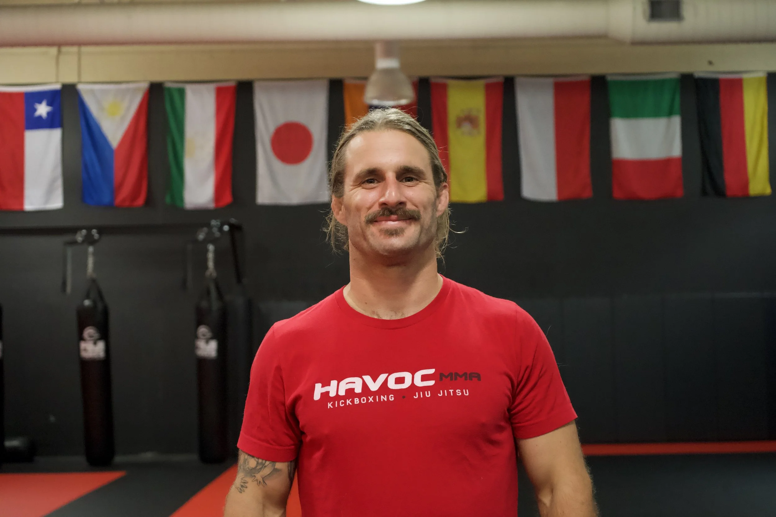 Text reading 'Coming Soon' written in red cursive on a white background.