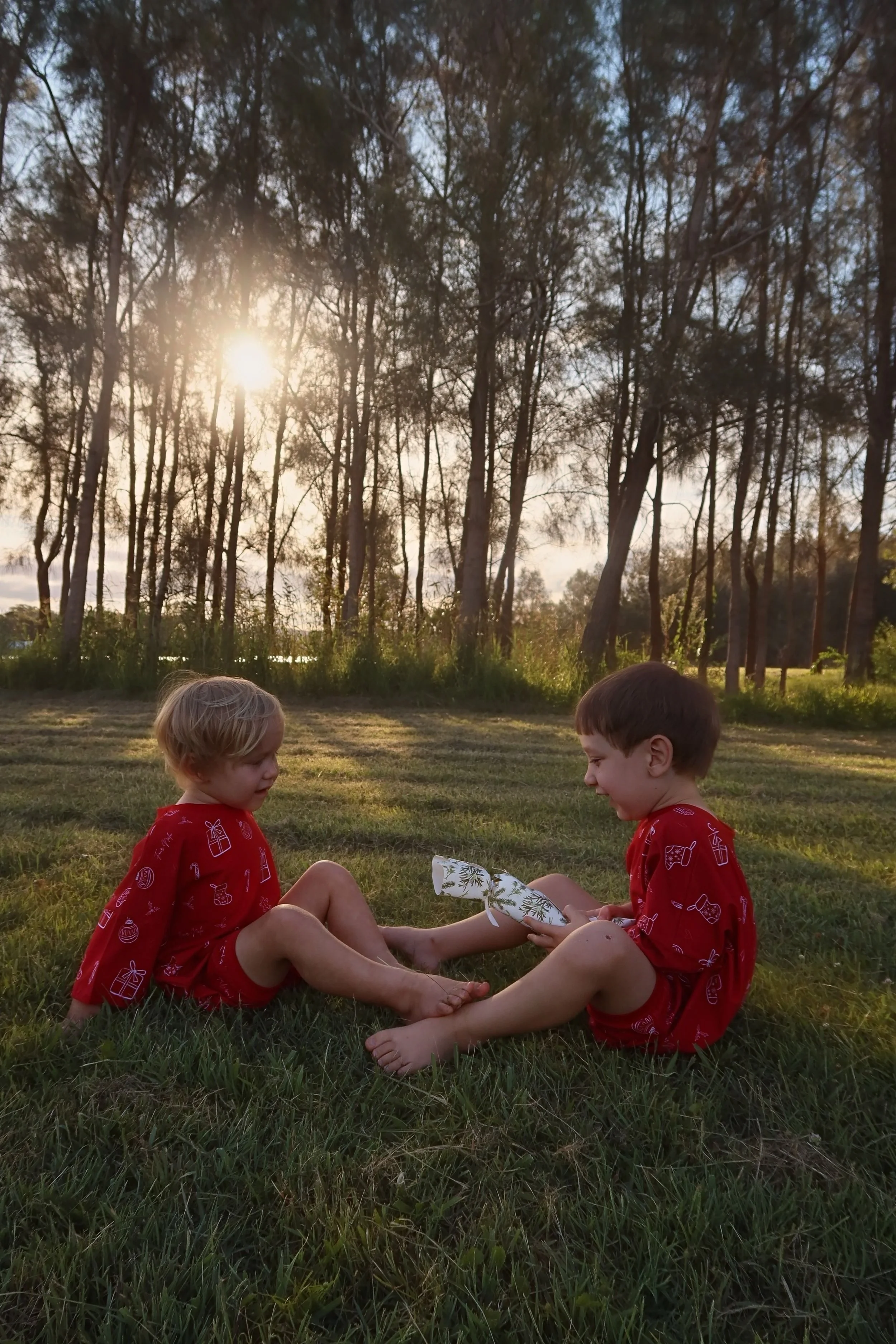 an image with two children playing wearing rompers