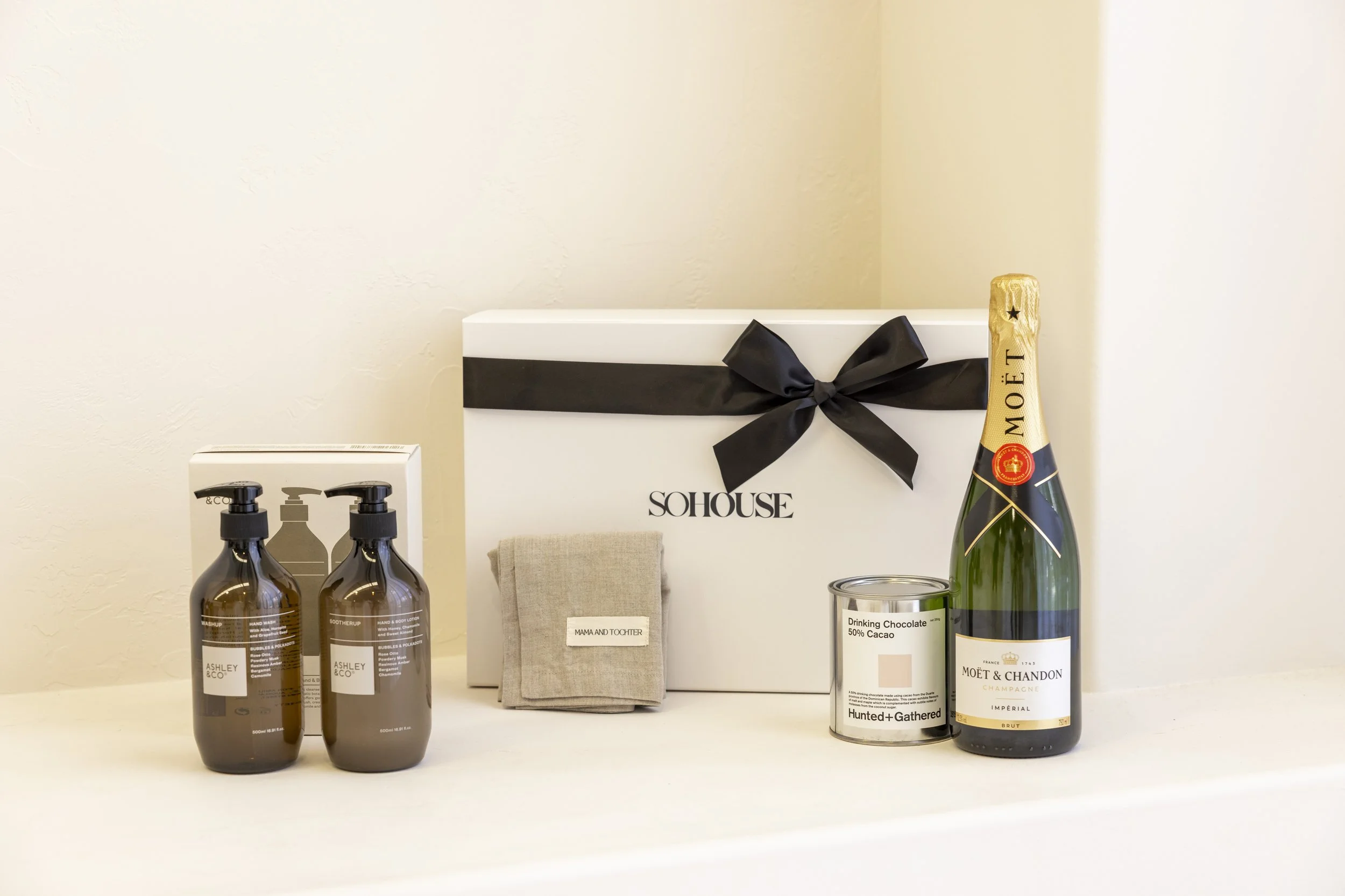 Product photography shoot at Luma Space Sunshine Coast including a collection of products in a box labeled "SOHOUSE."
