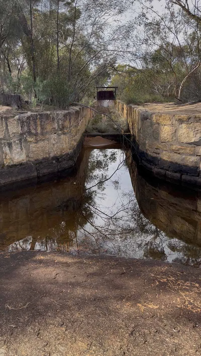 Entrance to the half pipe that leads to the dam where the water is funnelled to from the stone wall