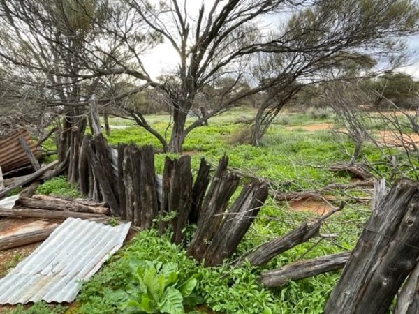 A field with a broken fence