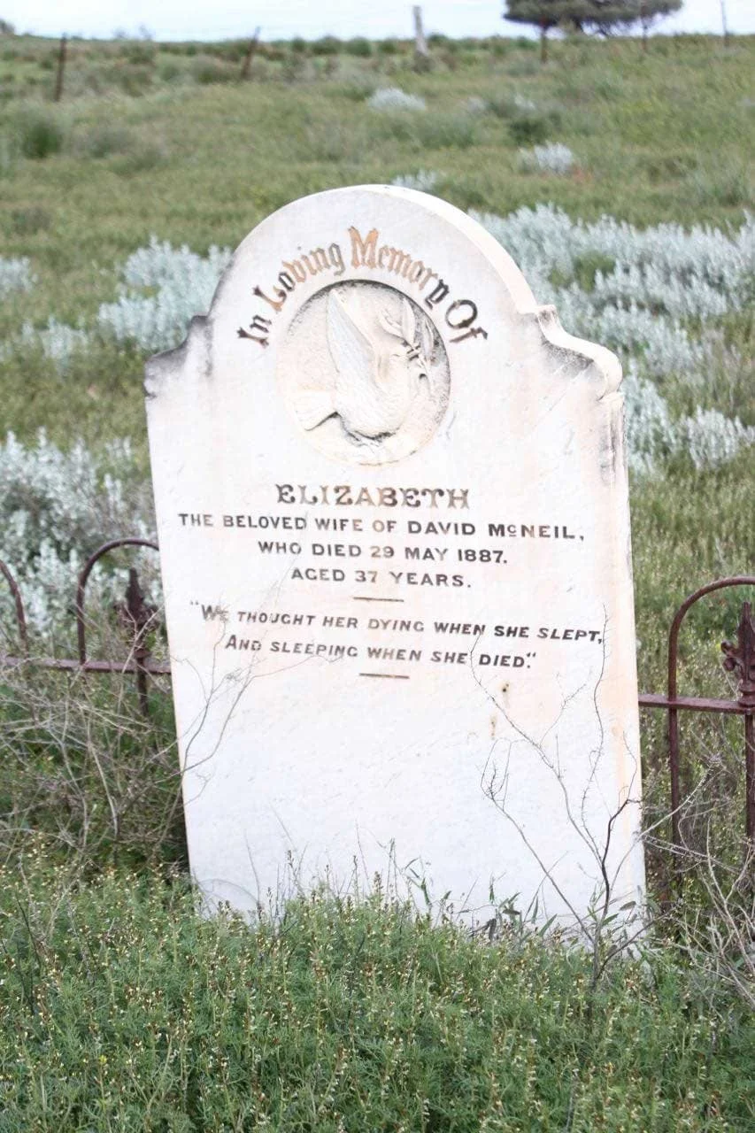 Close up of a white old headstone
