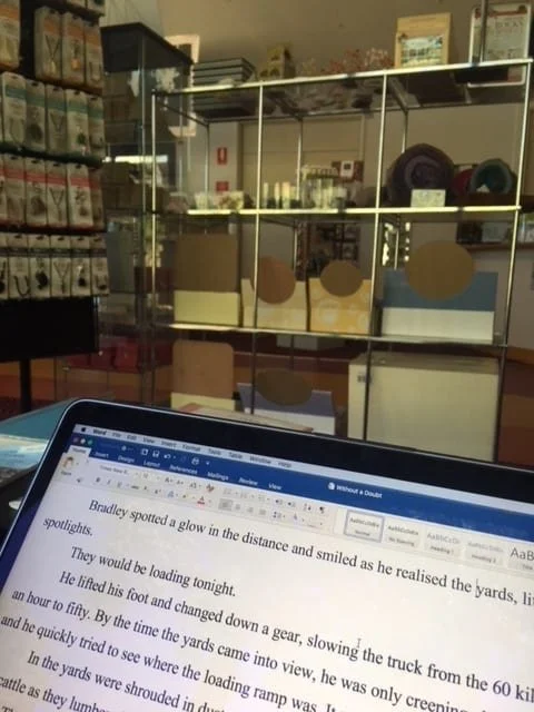 The top of a laptop in a a shop setting