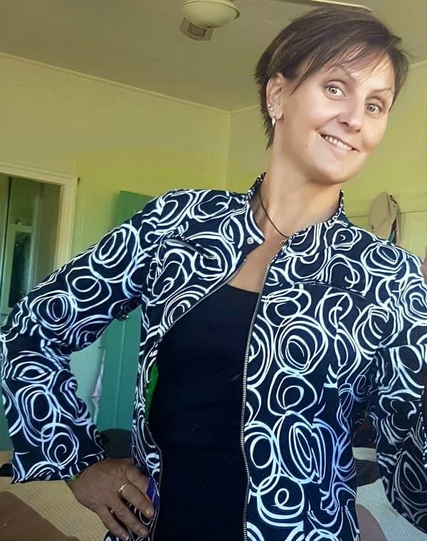 A sassy shot of Helen dressed up. Hand on hip smiling at the camera